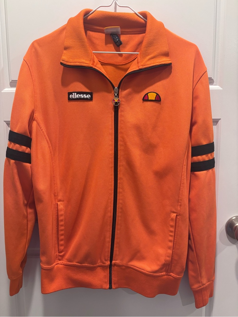 ellesse Bright Orange Track Jacket with Black Sleeve Stripes